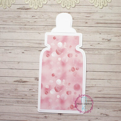 baza biała w kształcie butelki z warstwą białą i w różowe kropki. Baza jest otwierana